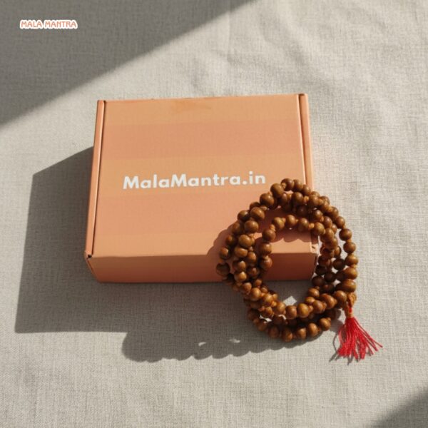 Authentic Chandan Mala with red tassel, natural wood color, for meditation