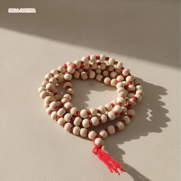 Premium Sandalwood or Tulsi wood meditation beads on red cord.