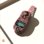 MalaMantra Digital Jaap Counter in a dark mahogany wood-grain finish resting on a minimalist beige tray.