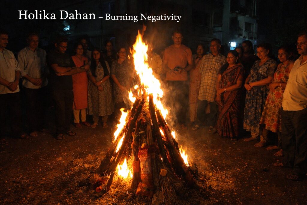 Holika Dahan bonfire ritual spiritual meaning fire purification Holi